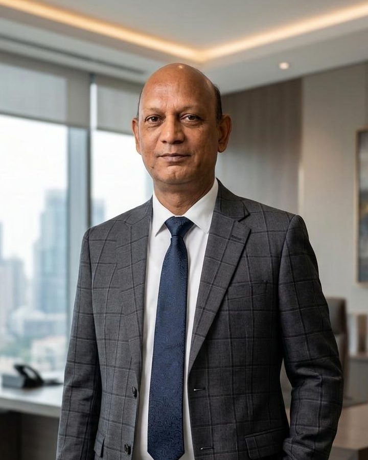 Sandeep Bhargava, Founder and Proprietor of Kkhatu Shyam Finance Corporation, in a business suit in an office